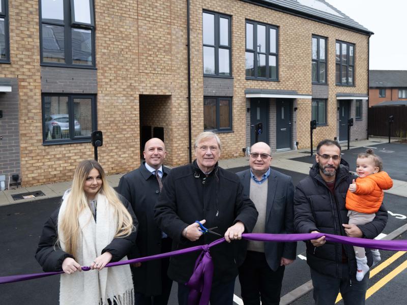 Cllr Mark Parker, Cllr Ian Courts and Cllr Andy Mackiewicz joined by Kinghurst residents outside the new Mountfort homes