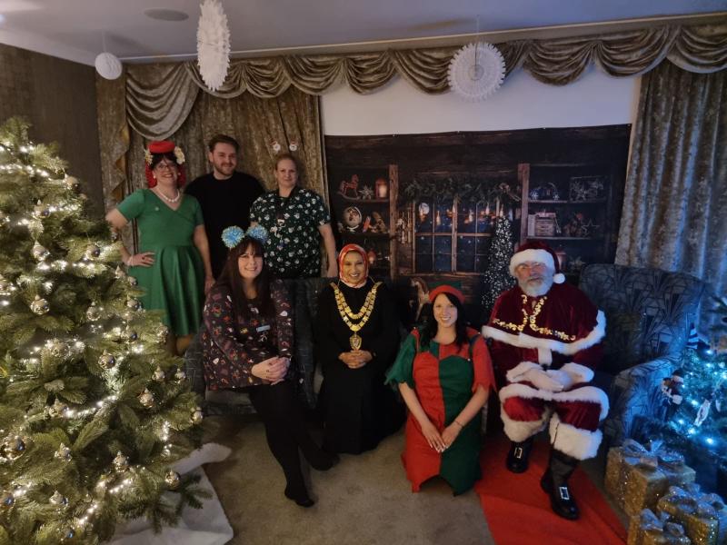 The Mayor pictured with Santa and a Christmas tree at Blythe Rose Care Home Christmas Fun Day