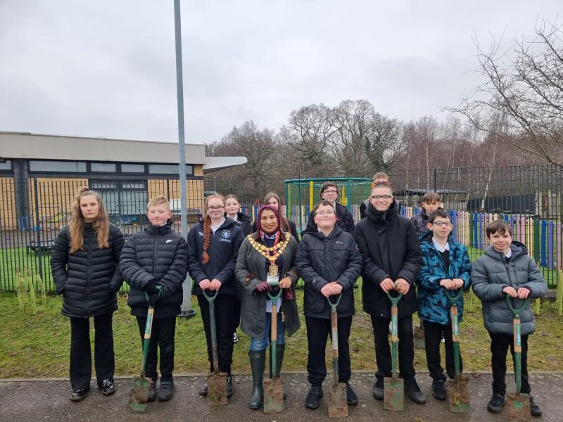 The Mayor of Solihull with students stood in front of Forest Oak School with spades in hand. 