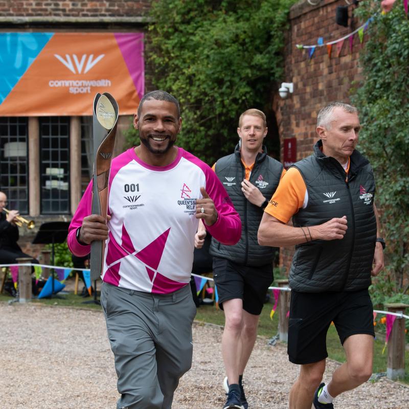 Wayne Elcock with Commonwealth games baton