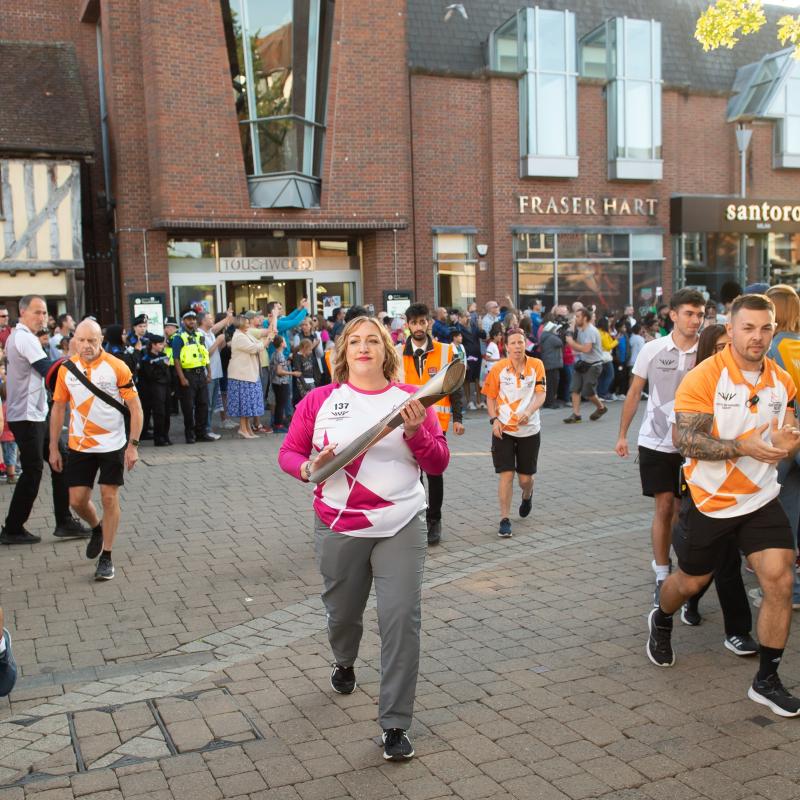 Commonwealth games baton being carried through Mell Square