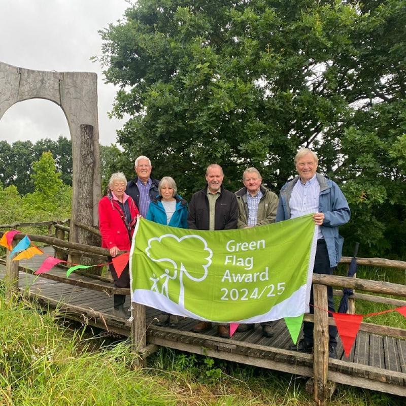 Cllr Courts and Cllr Hawkins with Friends of Hope Coppice as they celebrate the new Green Flag award